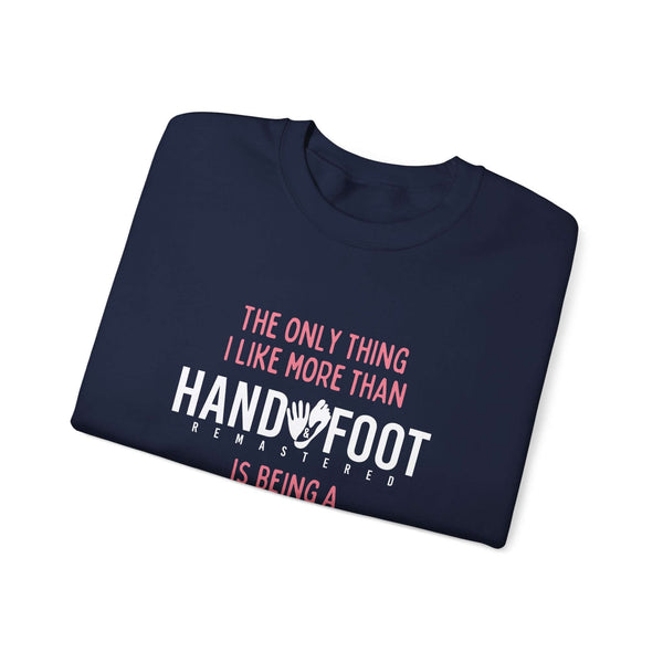 Navy blue crewneck sweatshirt with "The Only Thing I Like More Than Handy Foot is Being a Grandma" text design.