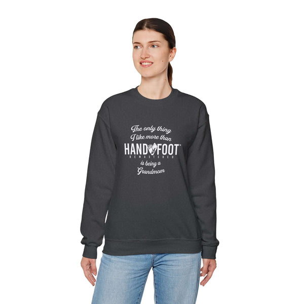 Woman wearing 'Being a Grandmom' unisex heavy blend crewneck sweatshirt, perfect gift for grandmothers, emphasizing comfort and style.