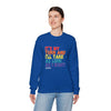 Model wearing blue 'It's My Turn' crewneck sweatshirt with colorful text, casual jeans, promoting unisex comfort and playful style.