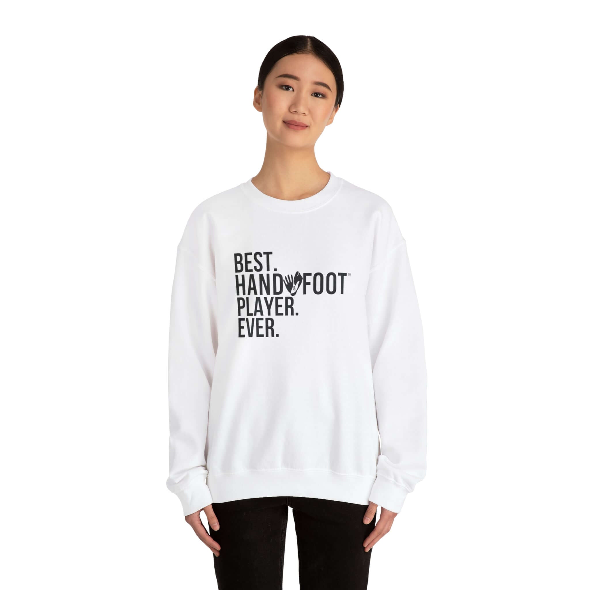 Person wearing a white crewneck sweatshirt with 'Best Hand Foot Player Ever' design, showcasing cozy and sustainable unisex fashion.