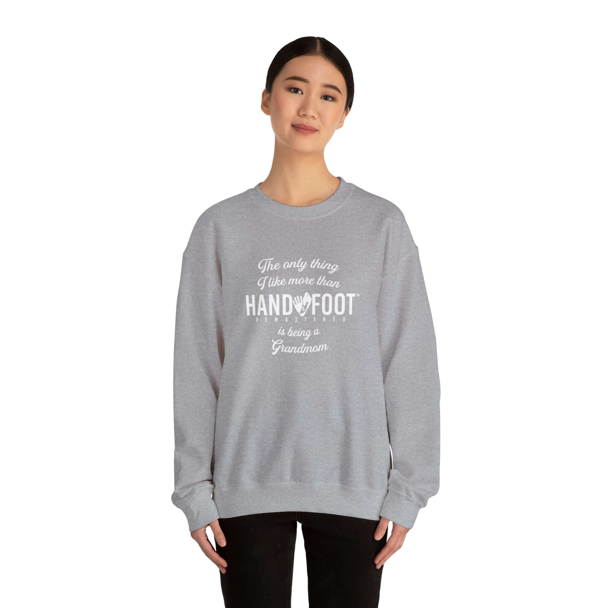Model wearing a gray 'Being a Grandmom' unisex crewneck sweatshirt, perfect gift for grandmothers, offering comfort and sustainability.