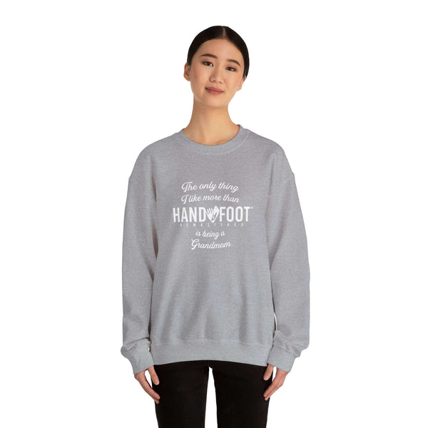 Model wearing a gray 'Being a Grandmom' unisex crewneck sweatshirt, perfect gift for grandmothers, offering comfort and sustainability.