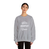 Person wearing a grey Hand & Foot Queen Unisex Heavy Blend Crewneck Sweatshirt, featuring a crown design and "Queen" text in white.