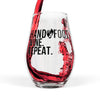 Black stemless wine glass with 'Hand & Foot Wine Repeat' lettering, pouring red wine. 11.75 oz capacity. High-quality glass with sleek design.