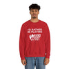 Red unisex crewneck sweatshirt with 'I'd Rather Be Playing Hand & Foot Remastered' design, worn by a person. Cozy and stylish.