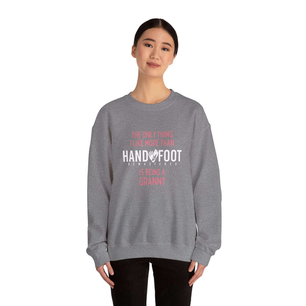 Model wearing 'Being a Granny' unisex heavy blend crewneck sweatshirt, showcasing cozy and sustainable fashion suitable for grandmothers.