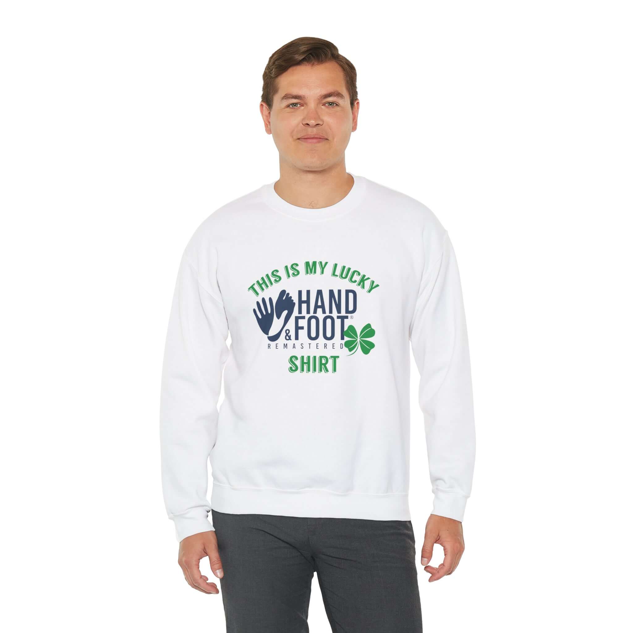 Person wearing a white crewneck sweatshirt with 'This is My Lucky Hand & Foot Shirt' text and clover design.