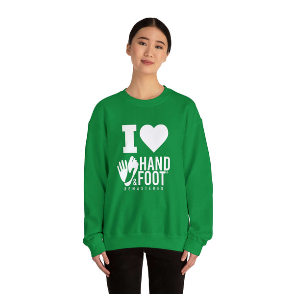 Person wearing green unisex crewneck sweatshirt with 'I Love Hand & Foot' design, perfect for comfort and sustainable fashion.