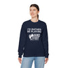 I'd Rather Be Playing Unisex Heavy Blend Crewneck Sweatshirt in navy blue, modeled by a person, featuring a cozy and sustainable design.