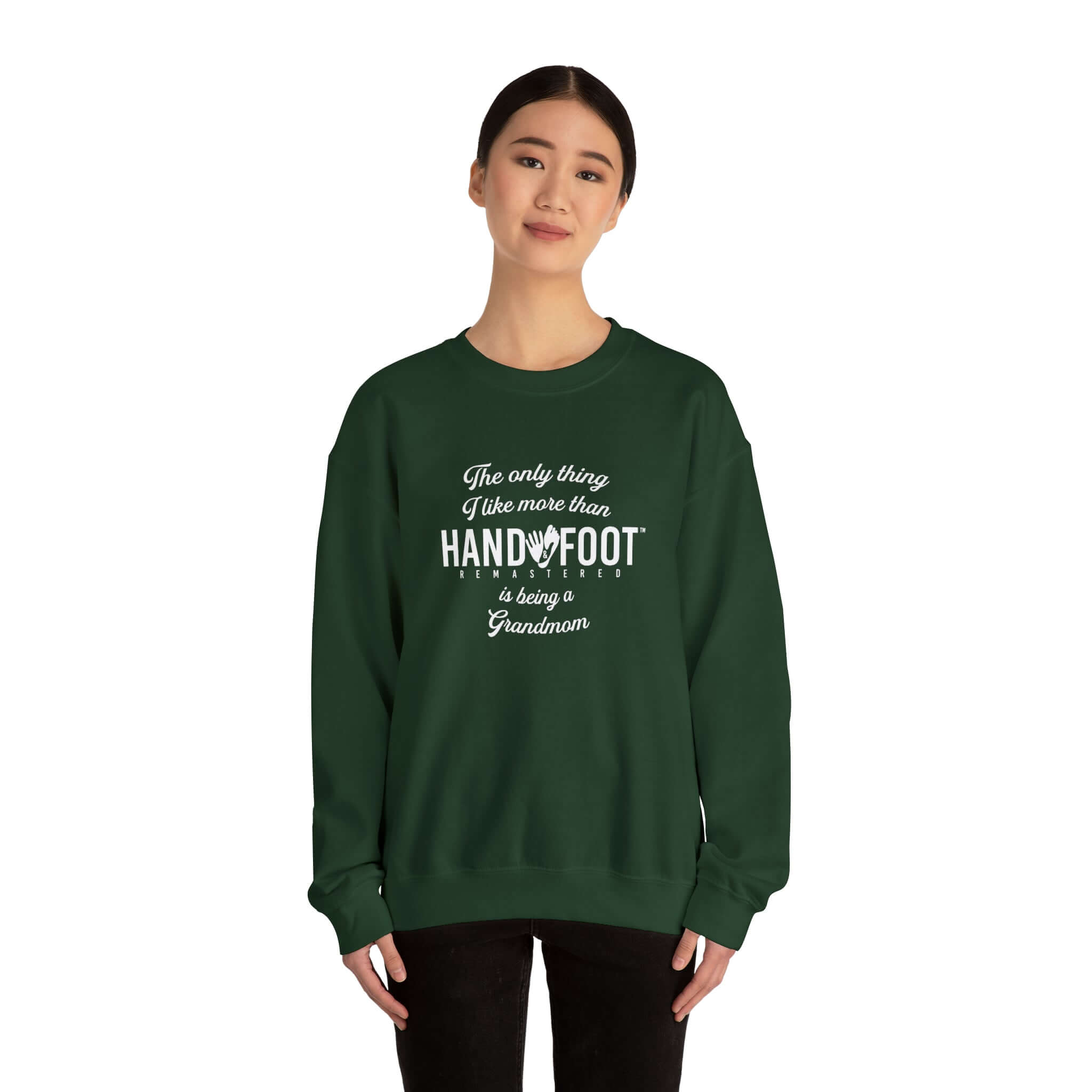 Woman wearing a green 'Being a Grandmom' unisex crewneck sweatshirt, perfect gift for grandmothers. Cozy and sustainable clothing.