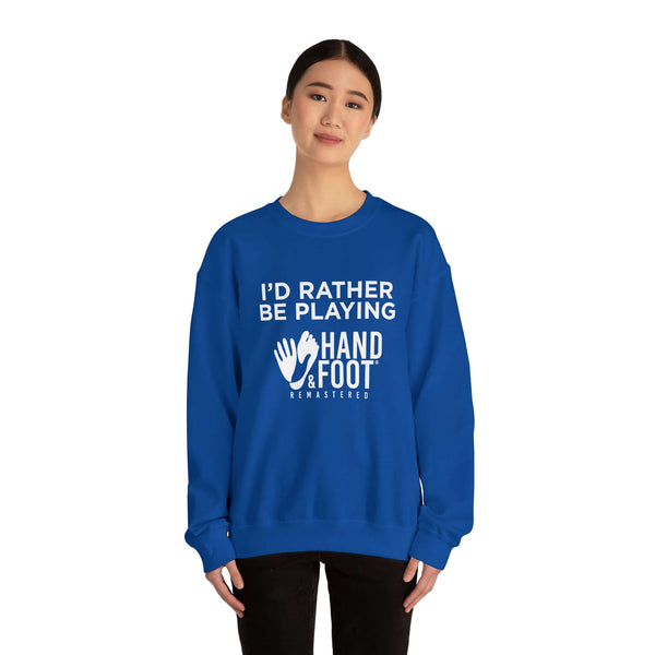Person wearing blue sweatshirt with 'I'd Rather Be Playing Hand & Foot Remastered' text, showcasing cozy and sustainable fashion.