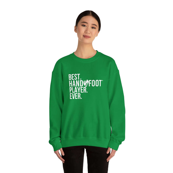 Woman wearing green Best Hand and Foot Player Ever unisex crewneck sweatshirt, showcasing comfort and playful design.