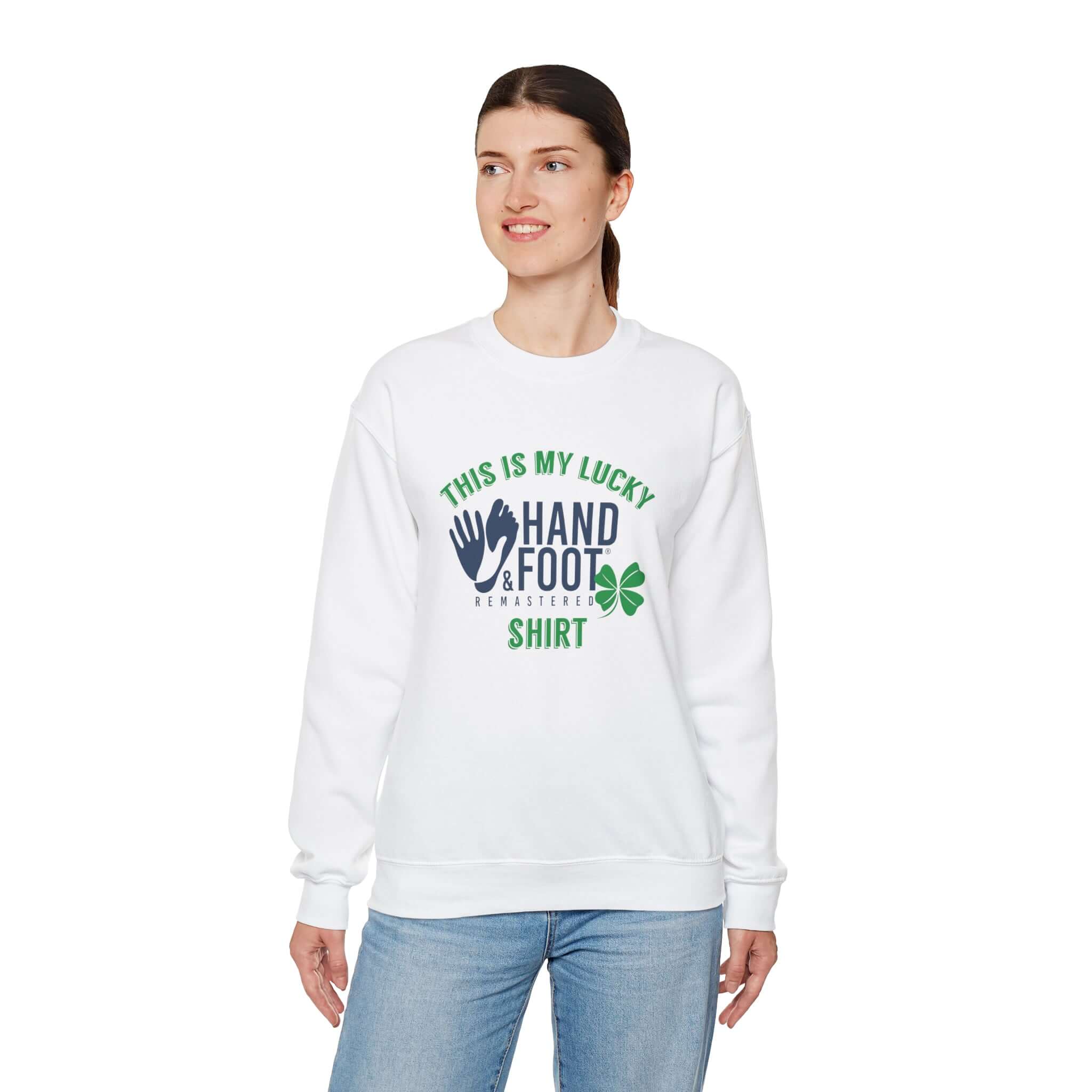 Woman wearing a white Lucky Unisex Heavy Blend Crewneck Sweatshirt with hand and foot graphic, perfect for comfort and sustainability.