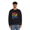 Man wearing 'It's My Turn' black unisex crewneck sweatshirt with colorful text, relaxed fit.