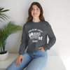 Woman wearing Lucky Unisex Heavy Blend Crewneck Sweatshirt, sitting on a table with a plant, showcasing cozy and stylish design.