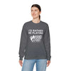 Model wearing 'I'd Rather Be Playing Hand & Foot' unisex heavy blend crewneck sweatshirt in dark gray.