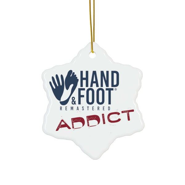 Snowflake-shaped ceramic ornament with "Hand & Foot Addict" logo, perfect for enthusiasts. High-quality, glossy finish, 0.125" thick.