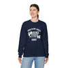 Woman wearing a navy Lucky Unisex Heavy Blend Crewneck Sweatshirt with a hand and foot design, promoting comfort and style.