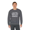 Man wearing Therapy Unisex Heavy Blend Crewneck Sweatshirt with Hand & Foot Remastered design.