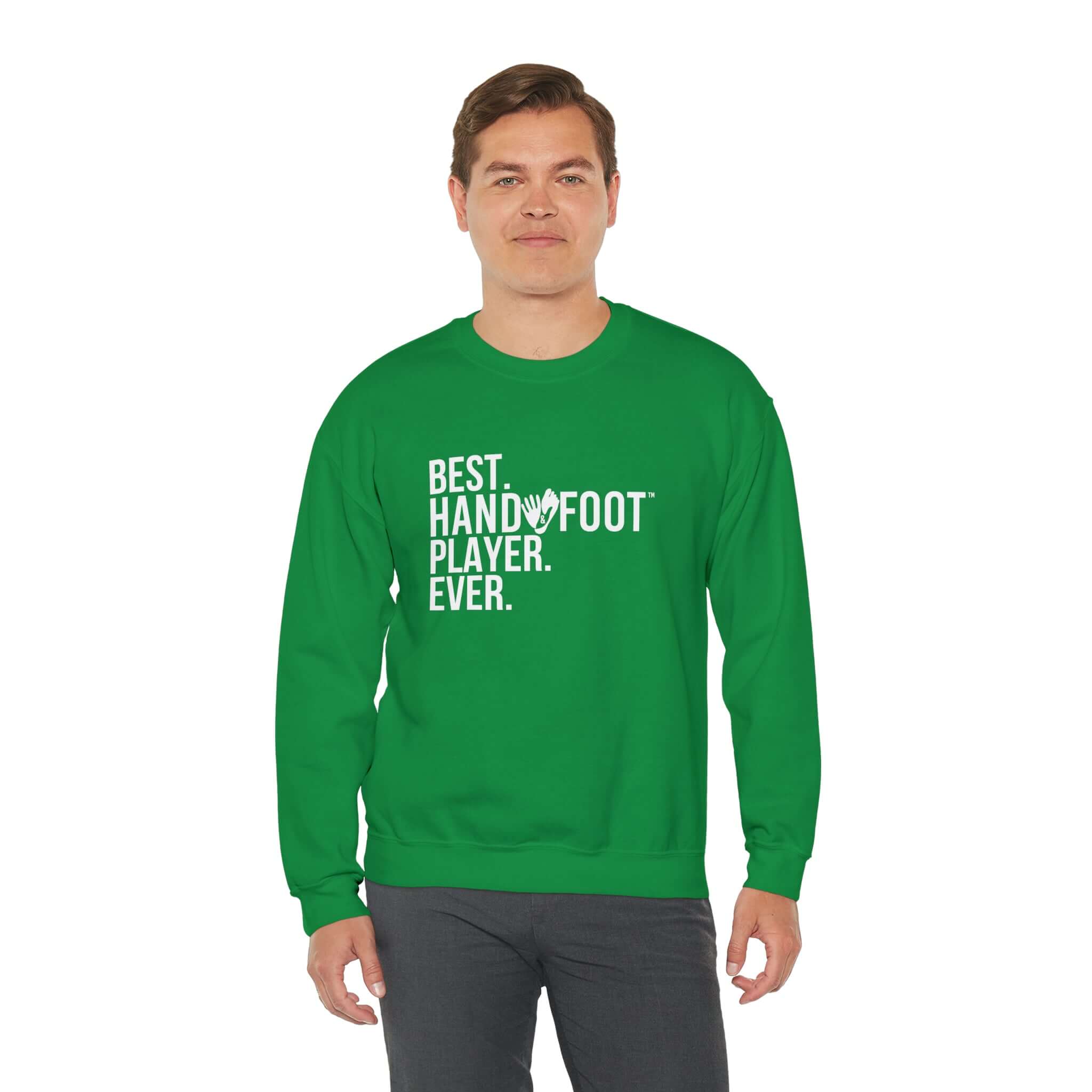 Man wearing green 'Best Hand Foot Player Ever' crewneck sweatshirt