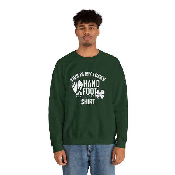 Model wearing Lucky Unisex Heavy Blend Crewneck Sweatshirt in forest green with 'This is my lucky hand & foot tournament shirt' text.