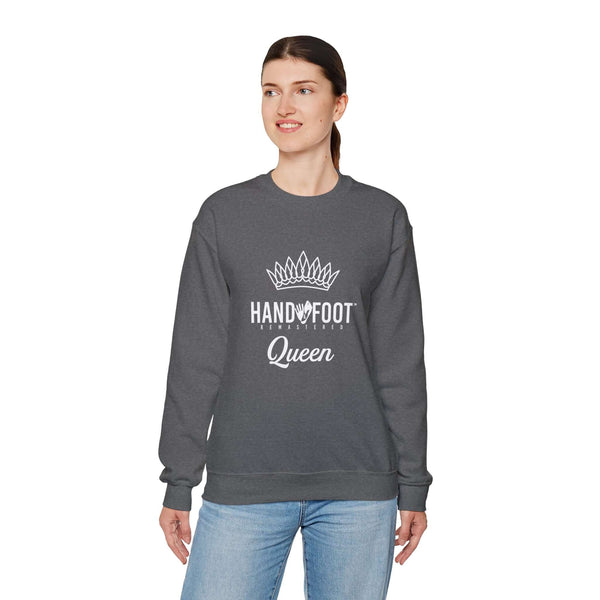 Model wearing dark grey Hand & Foot Queen Unisex Heavy Blend Crewneck Sweatshirt with crown design, perfect for cozy comfort.