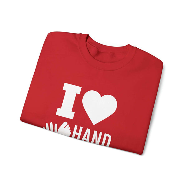 Red 'I Love Hand & Foot' unisex heavy blend crewneck sweatshirt folded