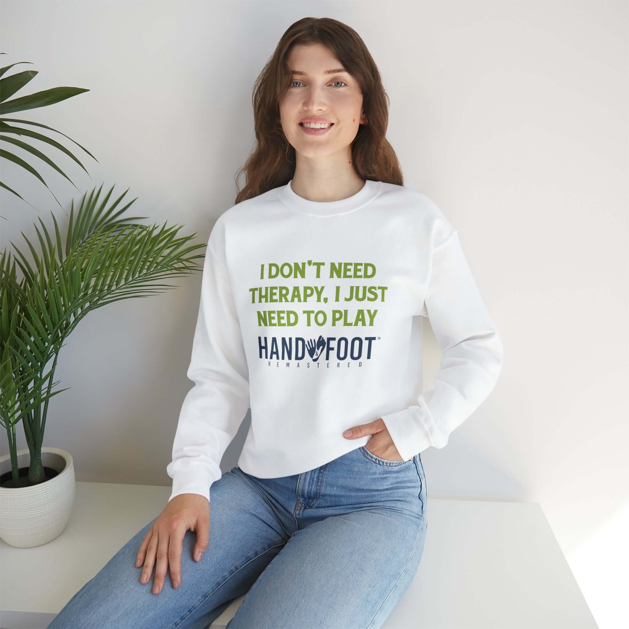 Woman wearing white crewneck sweatshirt with 'I Don't Need Therapy, I Just Need to Play Hand & Foot' text.