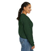 Woman wearing green unisex heavy blend crewneck sweatshirt, side view, with casual jeans.