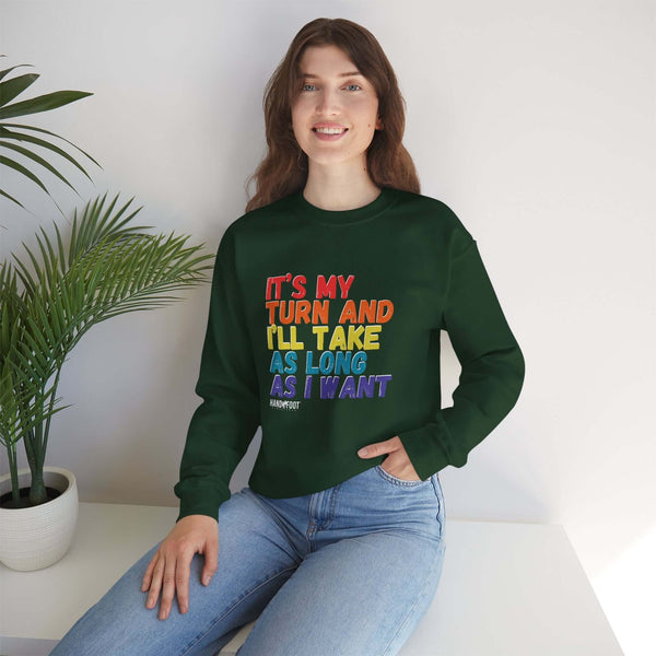 Person wearing 'It's My Turn' unisex crewneck sweatshirt, sitting with plant, promoting right to take time and make decisions in style.