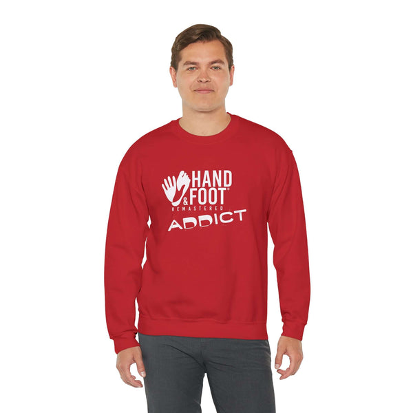 Model wearing red Hand & Foot Addict unisex heavy blend crewneck sweatshirt, featuring cozy and sustainable fashion design.