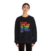Person wearing 'It's My Turn' unisex crewneck sweatshirt with colorful text on a black background.