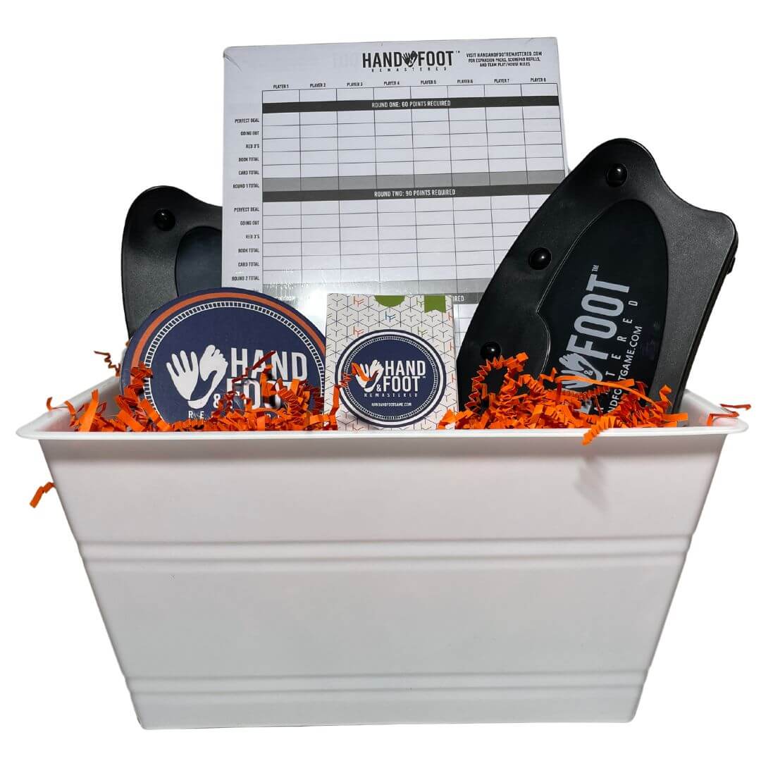 Hand & Foot Remastered Accessory Gift Set featuring action pack, score pad, and card holders in a decorative basket.