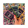 Colorful Hand & Foot Remastered cards in a hand, showcasing the game expansion for up to 8 players.
