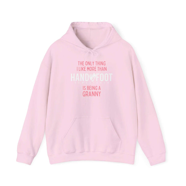 Pink hooded sweatshirt with "The only thing I like more than hand & foot is being a granny" playful message, kangaroo pocket.