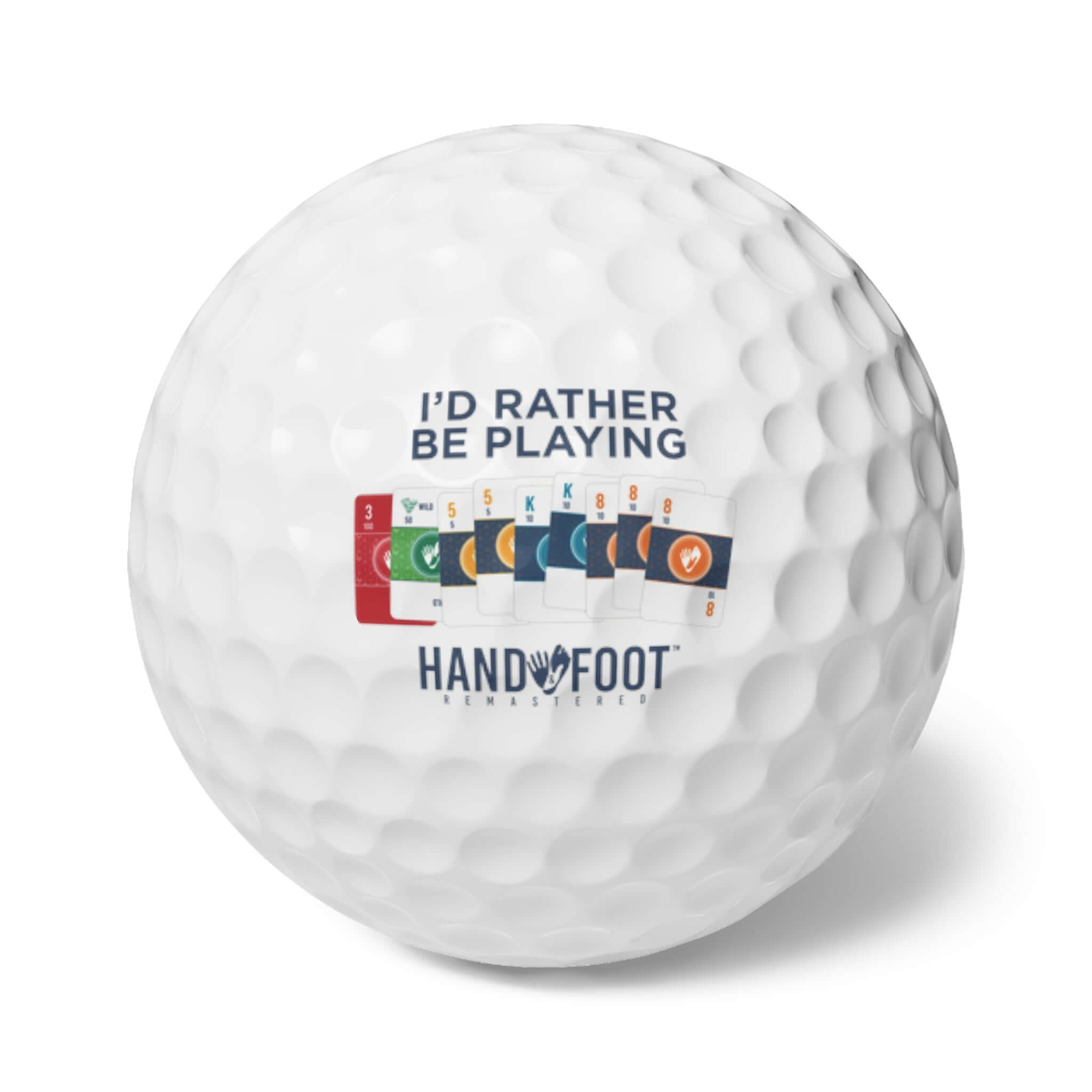 I'd Rather Be Playing Hand & Foot Remastered golf ball featuring colorful game cards, perfect for golf lovers.