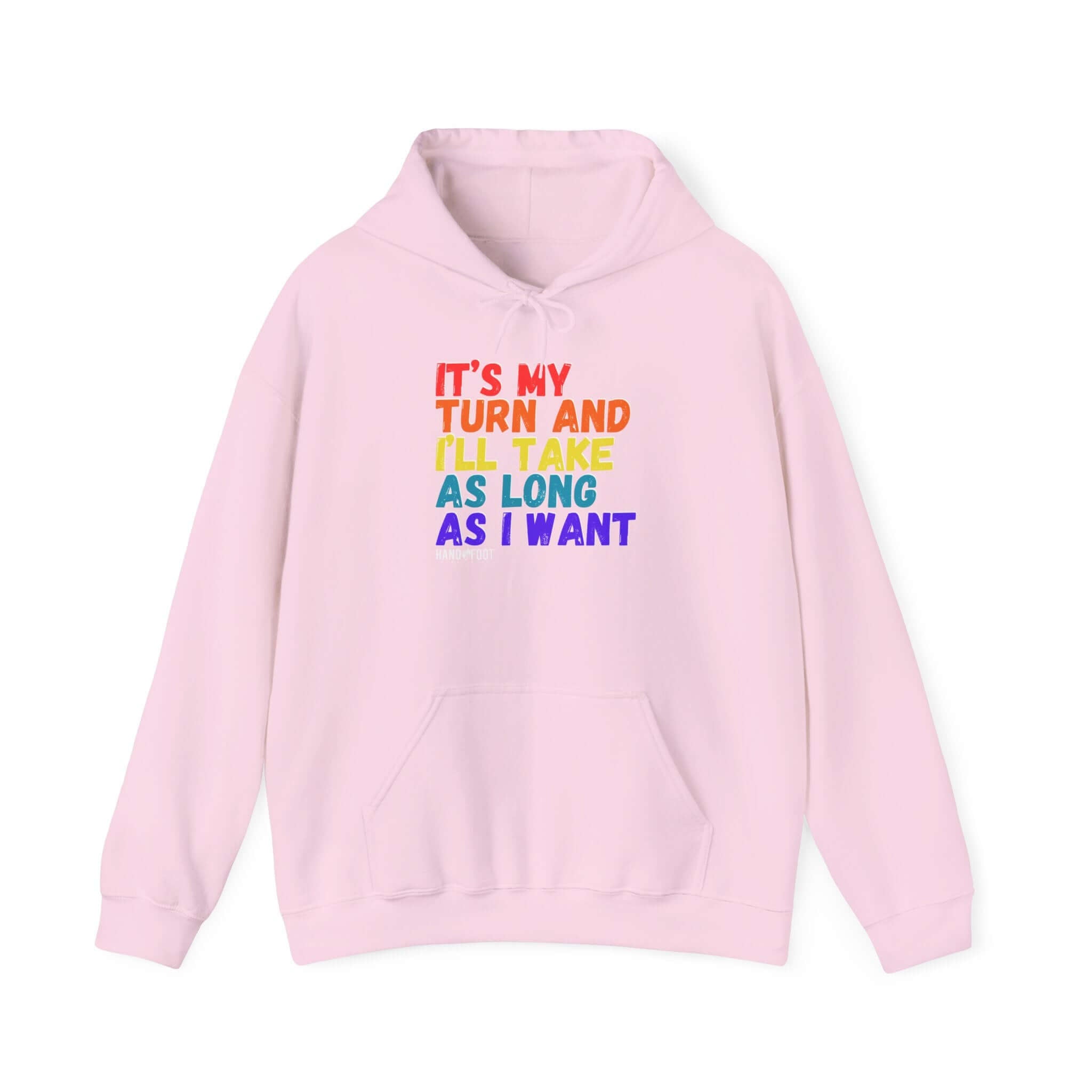 Pink hooded sweatshirt with colorful text 'It's My Turn and I'll Take As Long As I Want', featuring a cozy kangaroo pouch pocket.
