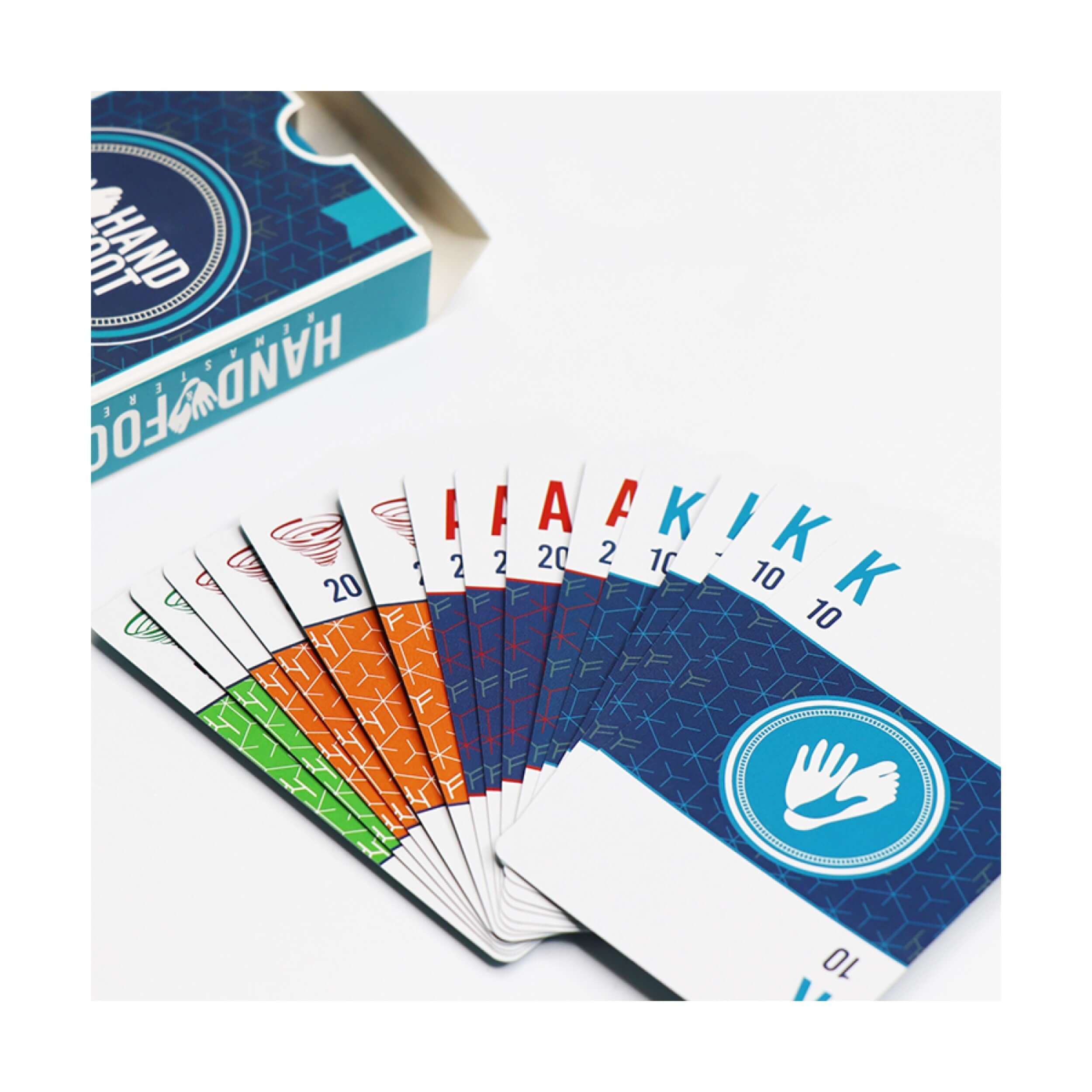 Colorful cards from the Scratch & Dent Hand & Foot game set displayed alongside the game box.