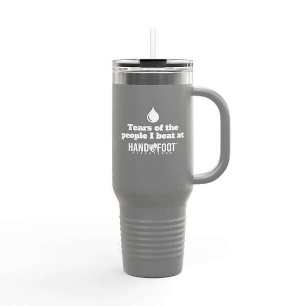 Gray 40oz insulated travel mug with "Tears of the people I beat at Hand Foot" text, featuring ergonomic handle and sip lid.