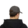 Man wearing World's Greatest Player Classic Dad Cap in charcoal, rear view with adjustable strap, hooded black jacket.