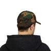 Back view of man wearing a camo-pattern classic dad cap, showcasing the relaxed fit and adjustable strap for casual style.