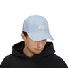 Man wearing World's Greatest Player Classic Dad Cap, light blue baseball hat with casual style, unstructured fit, ideal for everyday wear.
