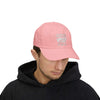 Man wearing pink World's Greatest Player classic dad cap with embroidered text, showcasing casual, stylish comfort.