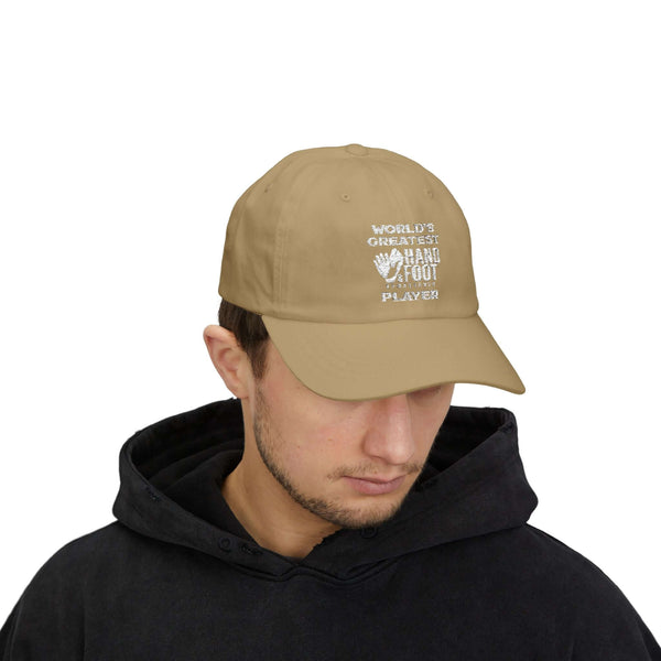 Man wearing a beige "World's Greatest Player" classic dad cap with black hoodie, showcasing relaxed fit and stylish design.
