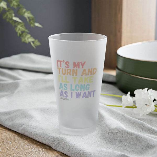 It's My Turn 16 oz Frosted Pint Glass with colorful text design on a table setting, ideal for gatherings and as a fun gift.