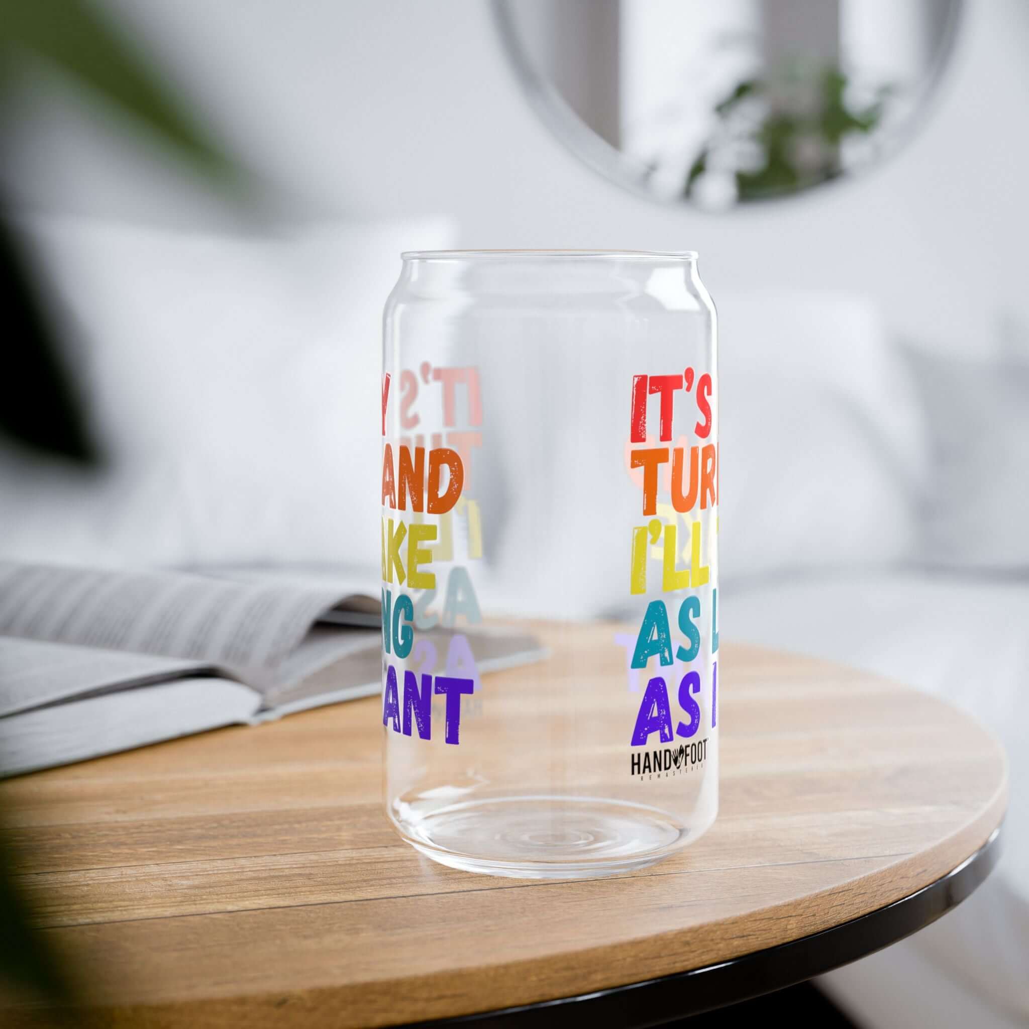 Colorful 16oz It's My Turn Sipper Glass on a wooden table, ideal for stylish hydration and lively gatherings.