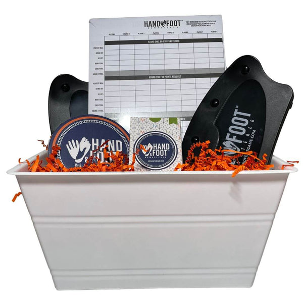Hand & Foot Remastered Accessory Gift Set featuring action pack, score pad, and card holders in a decorative basket.
