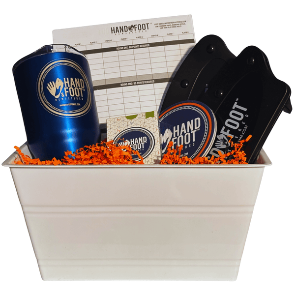 Limited-Edition Hand & Foot Remastered Accessory Set in white basket with score pad and branded accessories.