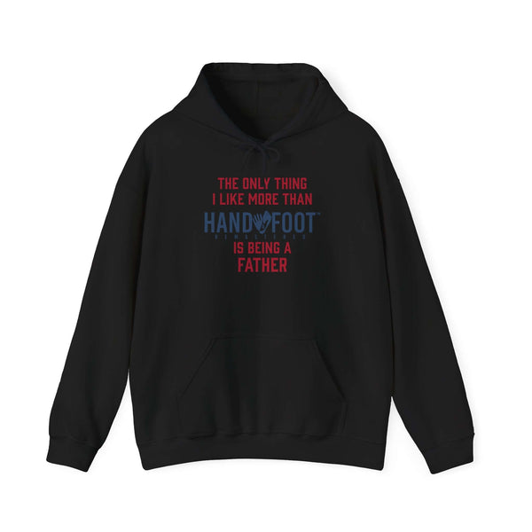 Black hooded sweatshirt with 'Being a Father' and playful hand-foot design, cozy fit with kangaroo pouch pocket for comfort and style.