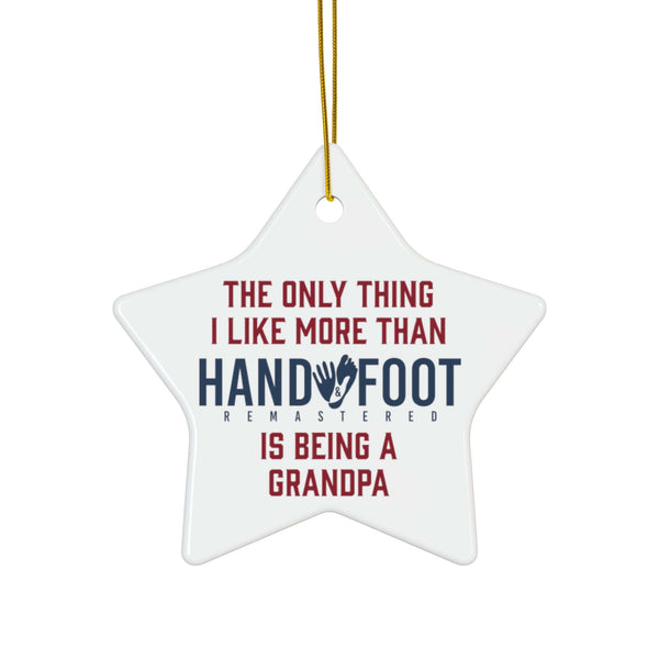 Star-shaped ceramic ornament with "The only thing I like more than hand-foot is being a Grandpa" text, glossy finish.